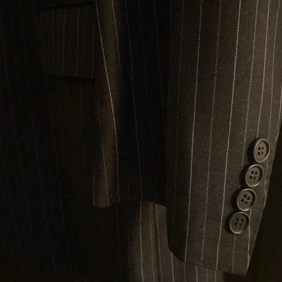Charcoal double striped suit. Two button, single breast, notch lapel.